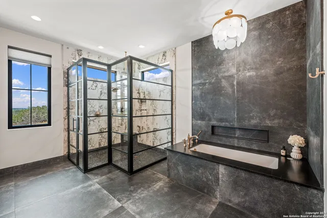 a spacious bathroom with a glass door shower