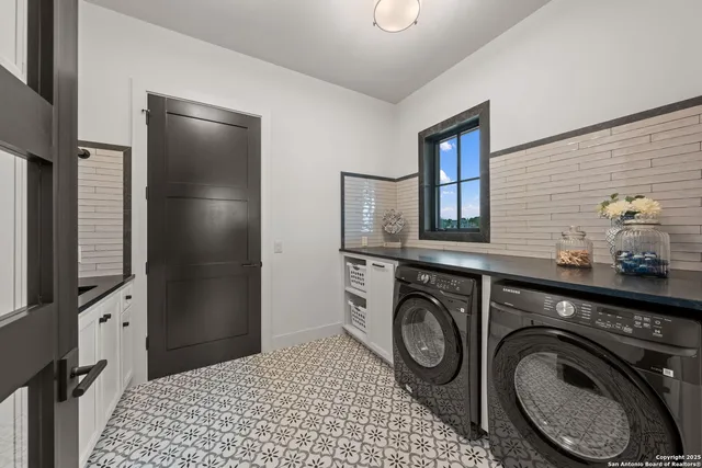 a view of washer and dryer in a utility room