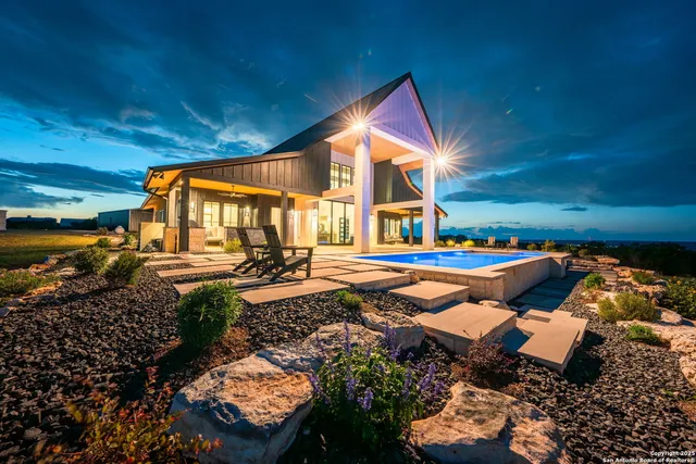 a view of a house with a swimming pool