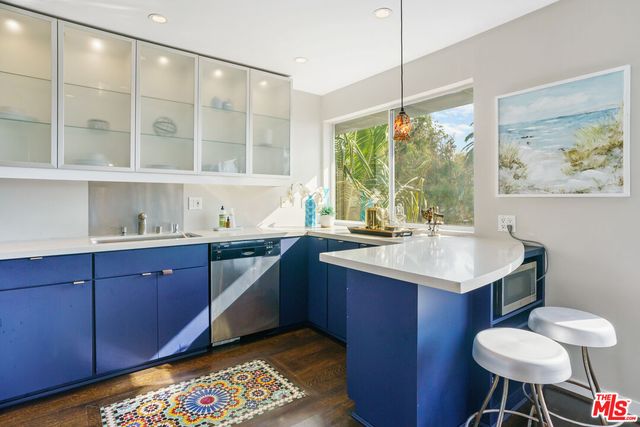 a kitchen with a sink and a stove