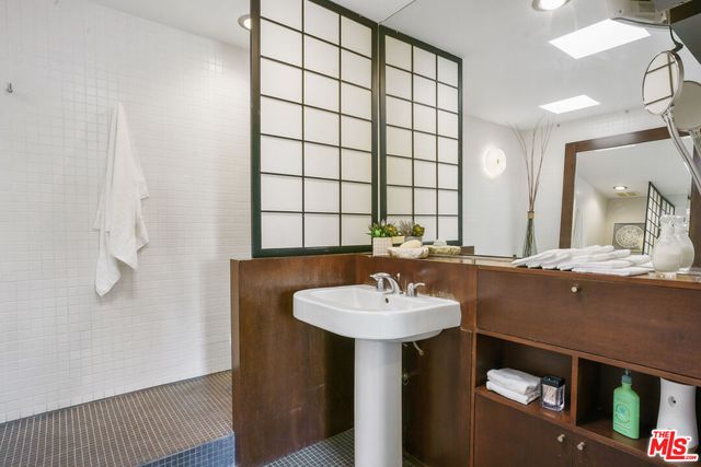 a bathroom with a sink and a mirror