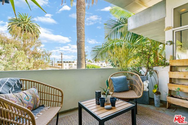 a view of balcony with furniture