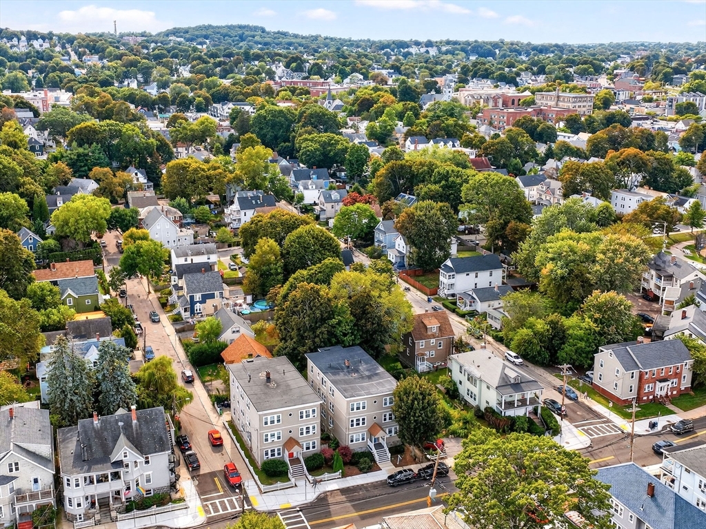187 Florence Street, Unit 2L Boston, MA 02131 - Photo 15 of 16 an aerial view of residential houses with outdoor space