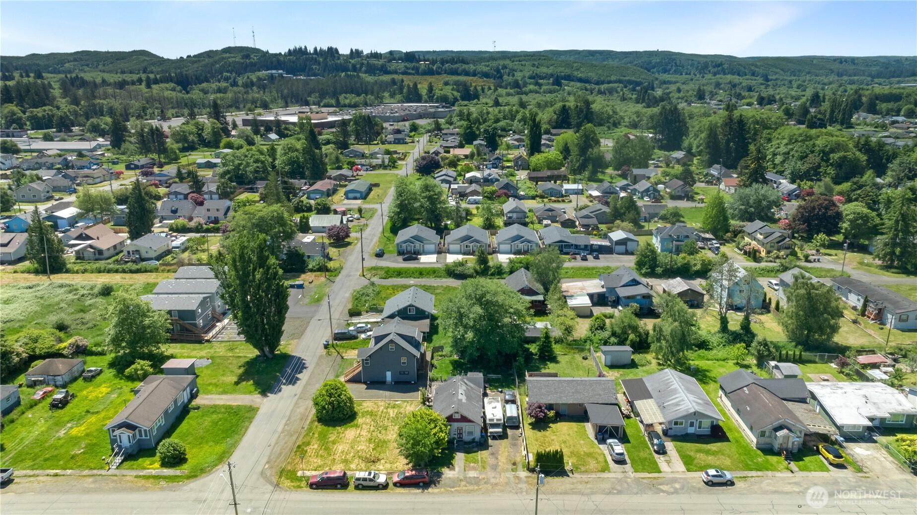 1105 West Perry Street Aberdeen, WA 98520 - Photo 19 of 20 an aerial view of residential houses with outdoor space and street view