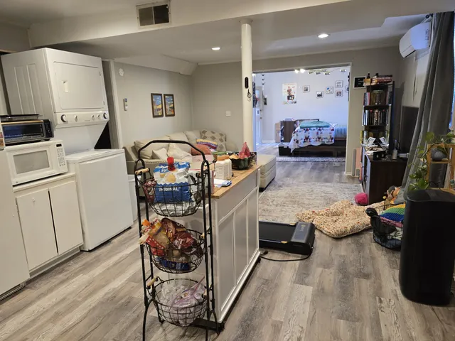 a living room with furniture and flat screen tv