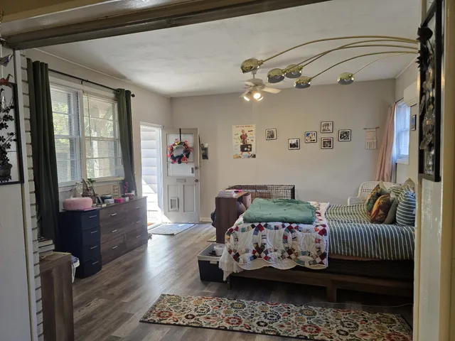 a bedroom with furniture or couch and a window