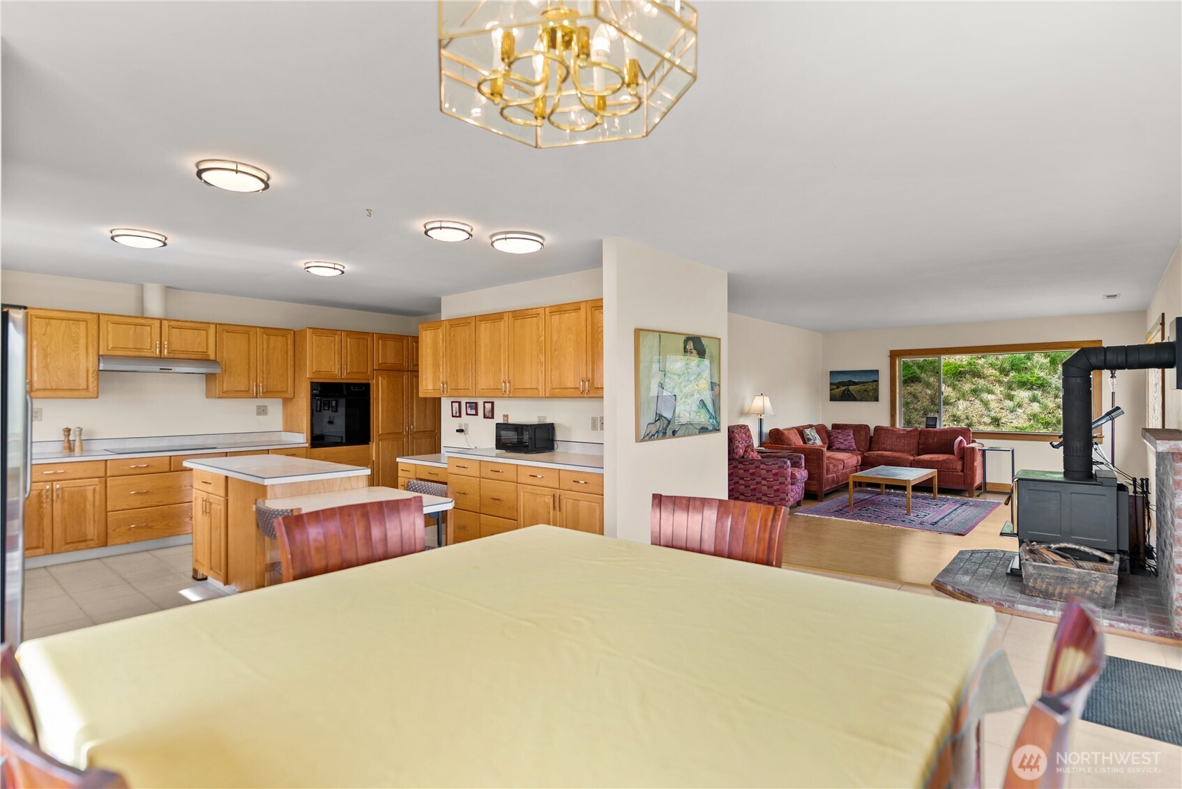 427 Rendezvous Road Winthrop, WA 98862 - Photo 18 of 40 a large living room with stainless steel appliances granite countertop furniture and a large window