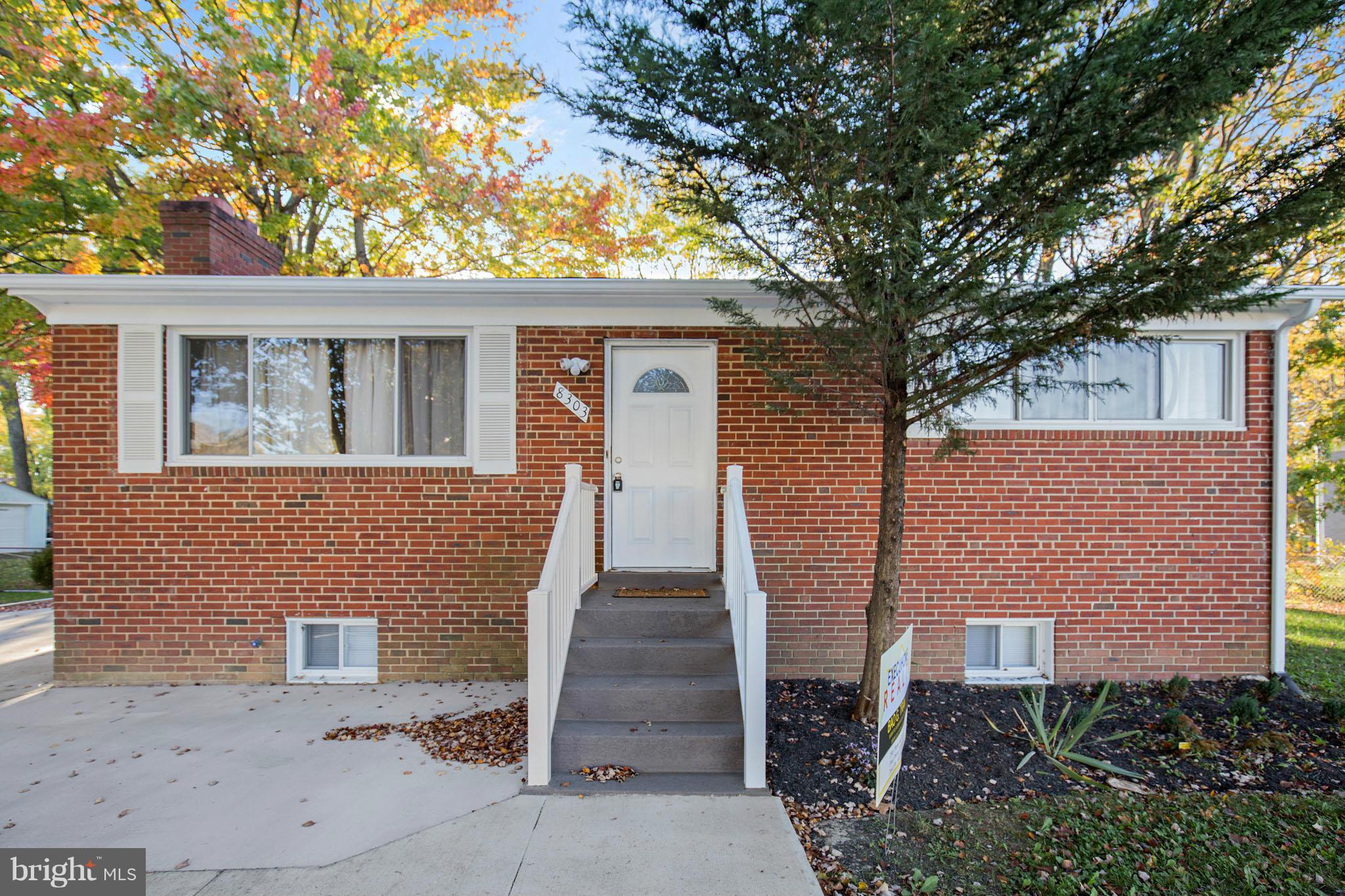 8303 Allentown Road Fort Washington, MD 20744 - Photo 1 of 30 a front view of a house with garden