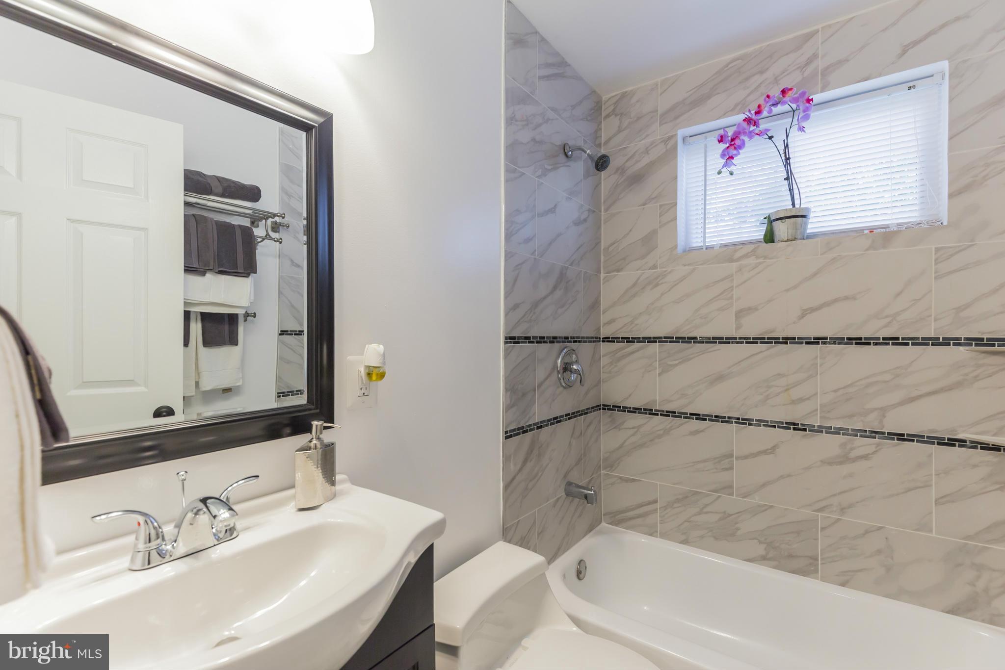 8303 Allentown Road Fort Washington, MD 20744 - Photo 13 of 30 a bathroom with a sink and a mirror
