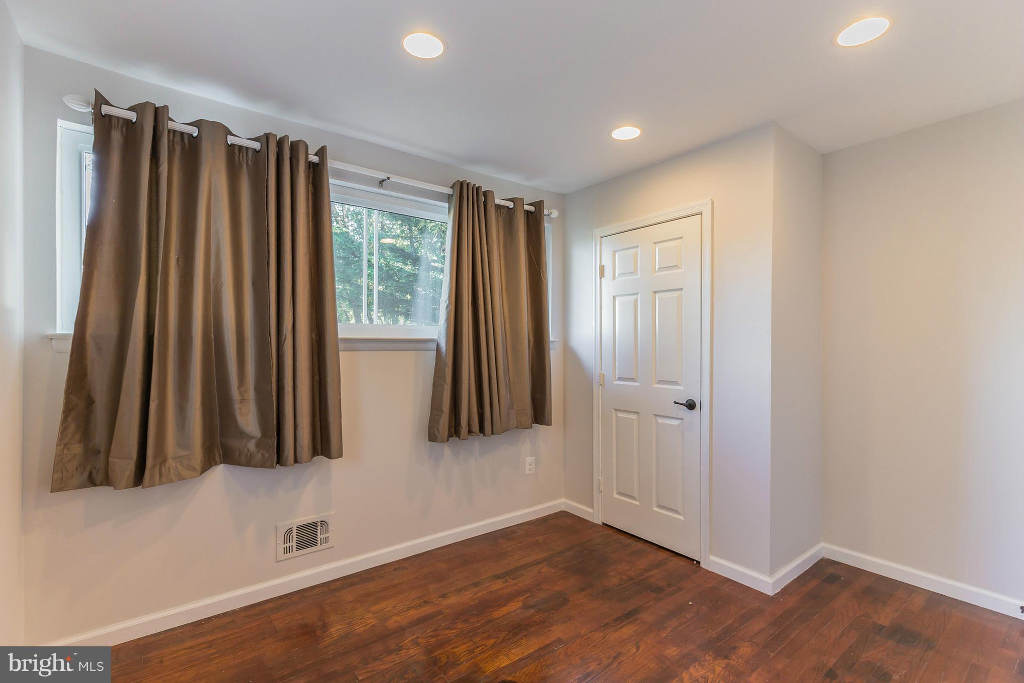 8303 Allentown Road Fort Washington, MD 20744 - Photo 15 of 30 wooden floor in an empty room