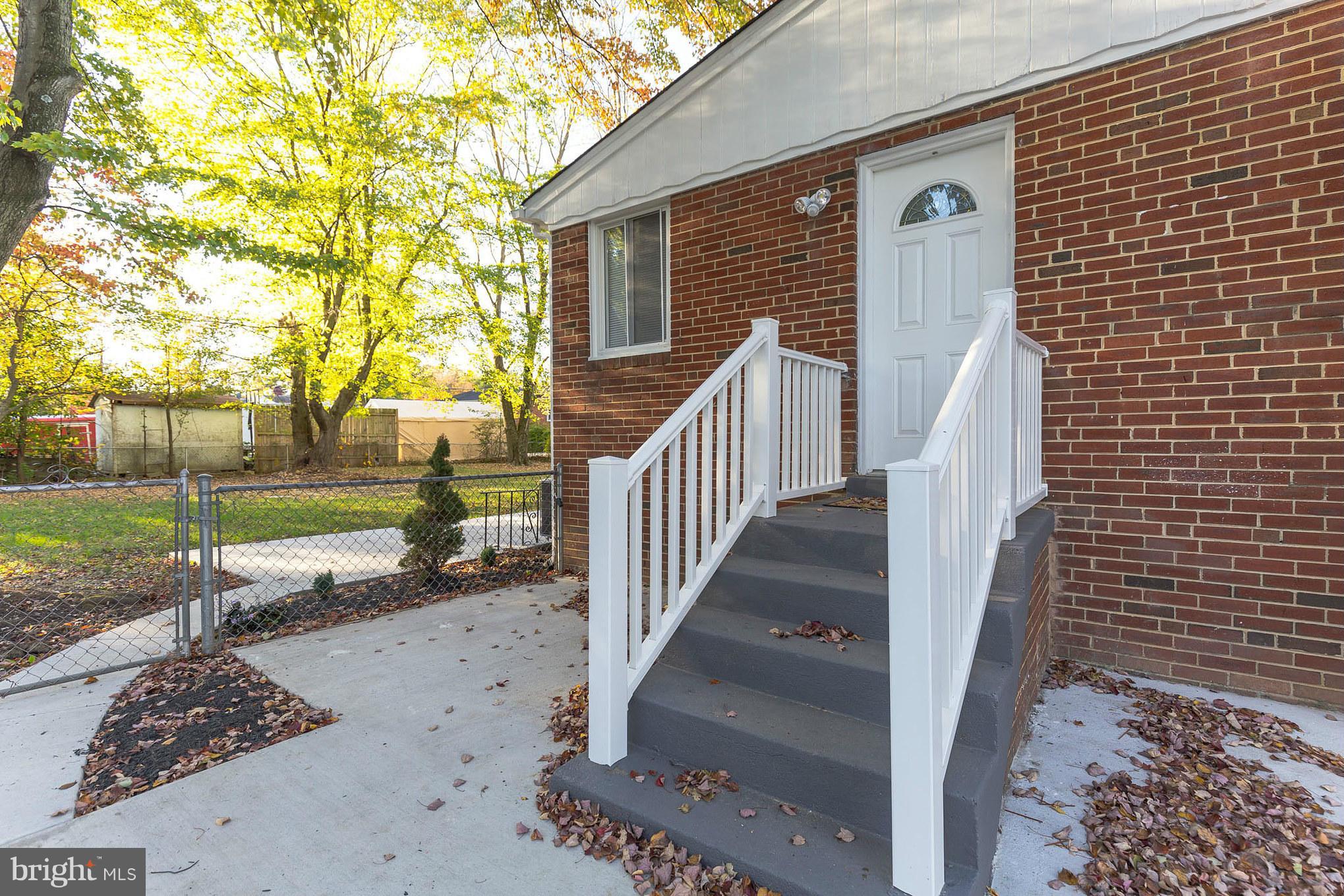 8303 Allentown Road Fort Washington, MD 20744 - Photo 28 of 30 a view of a house with a yard