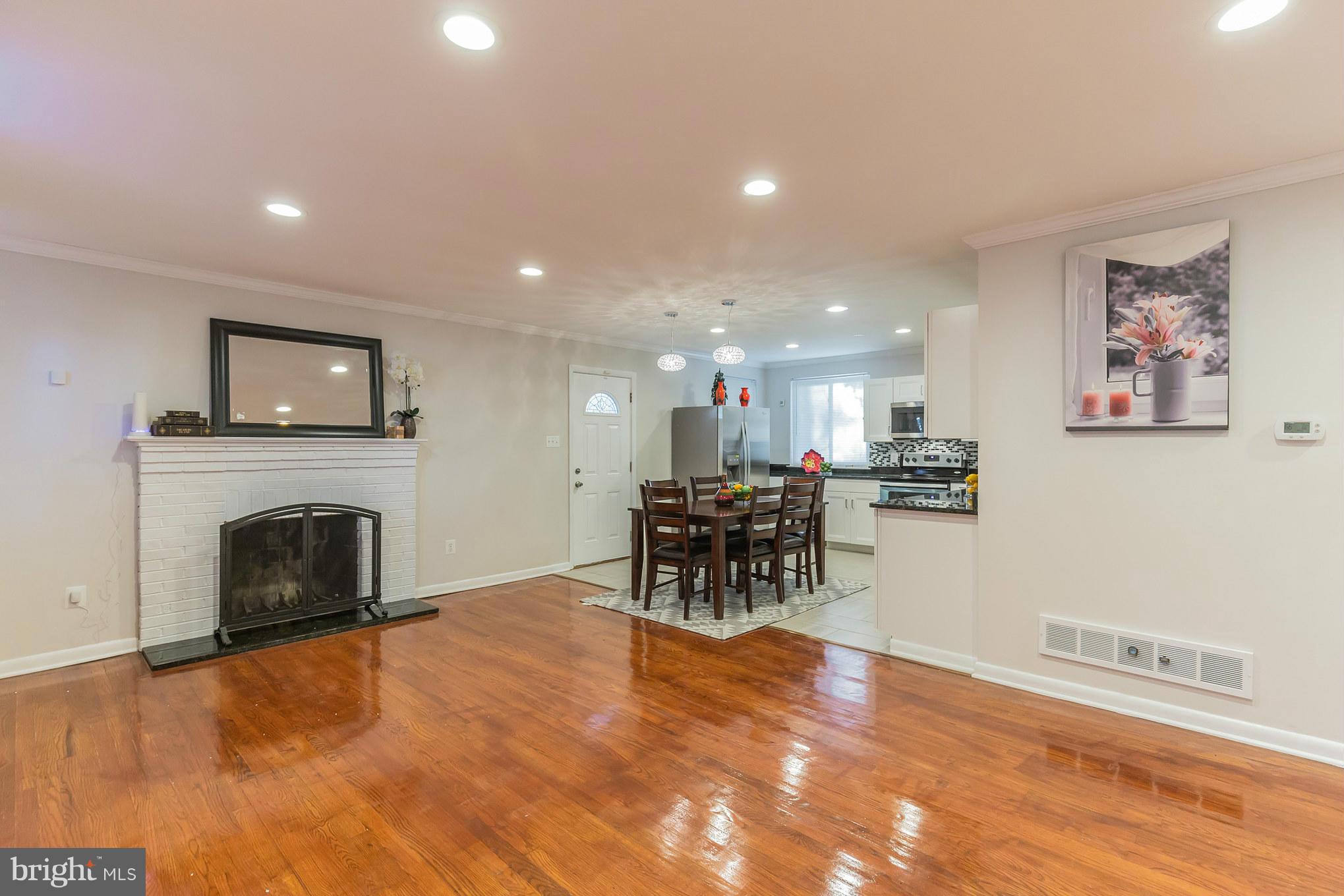8303 Allentown Road Fort Washington, MD 20744 - Photo 5 of 30 a view of a livingroom with furniture and a fireplace