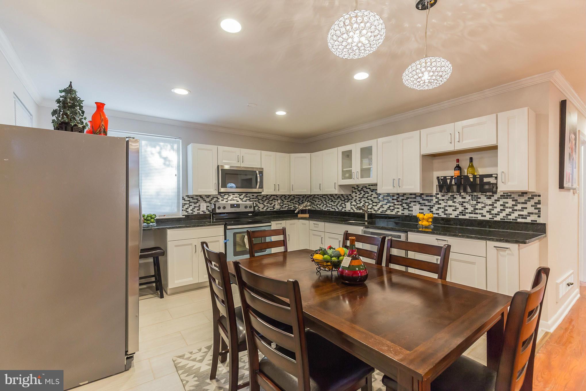 8303 Allentown Road Fort Washington, MD 20744 - Photo 10 of 30 a kitchen with a table and chairs in it