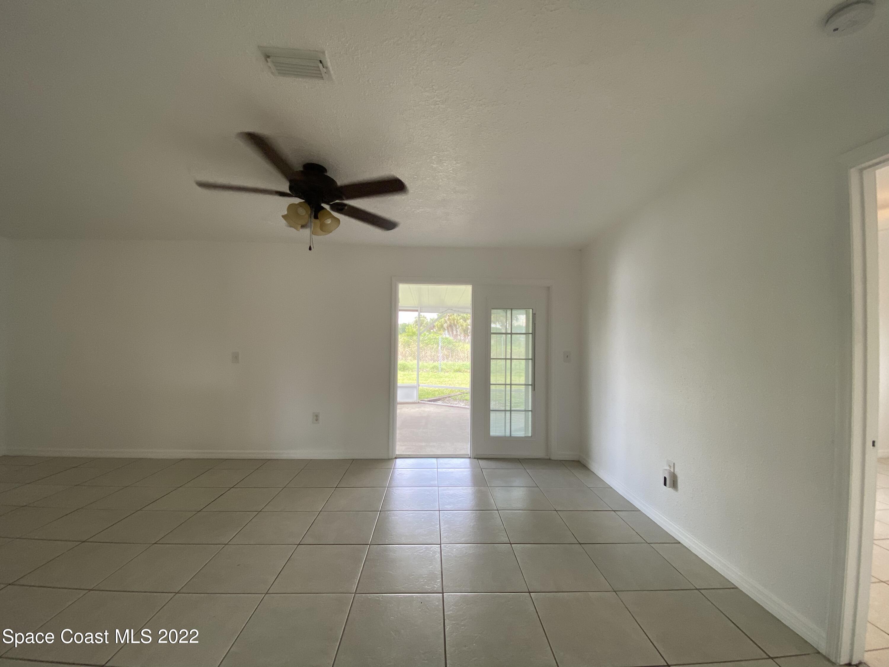 4120 Duke Street Melbourne, FL 32901 - Photo 18 of 49 a view of a livingroom with a ceiling fan and window