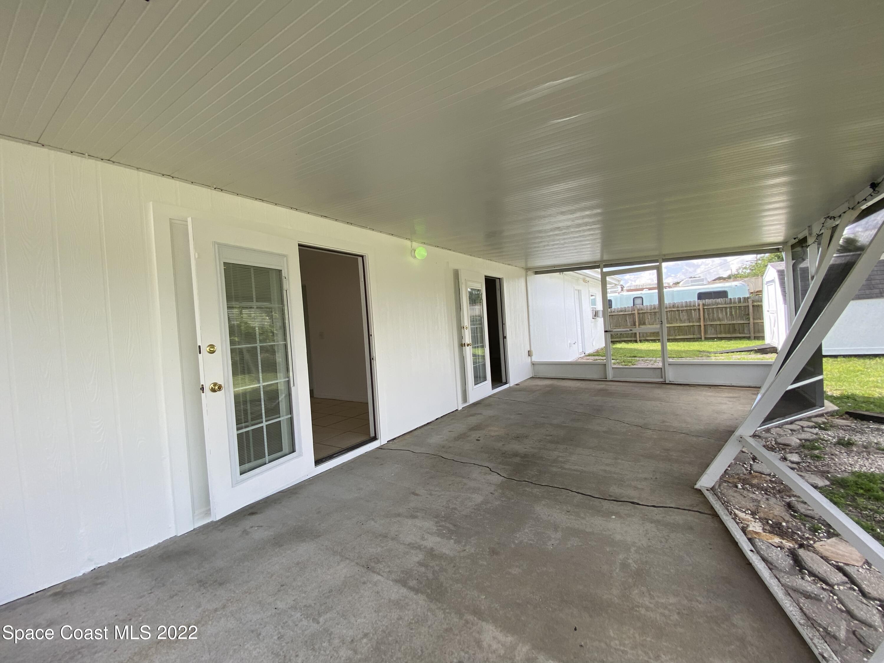 4120 Duke Street Melbourne, FL 32901 - Photo 22 of 49 a view of an empty room with wooden floor and a window