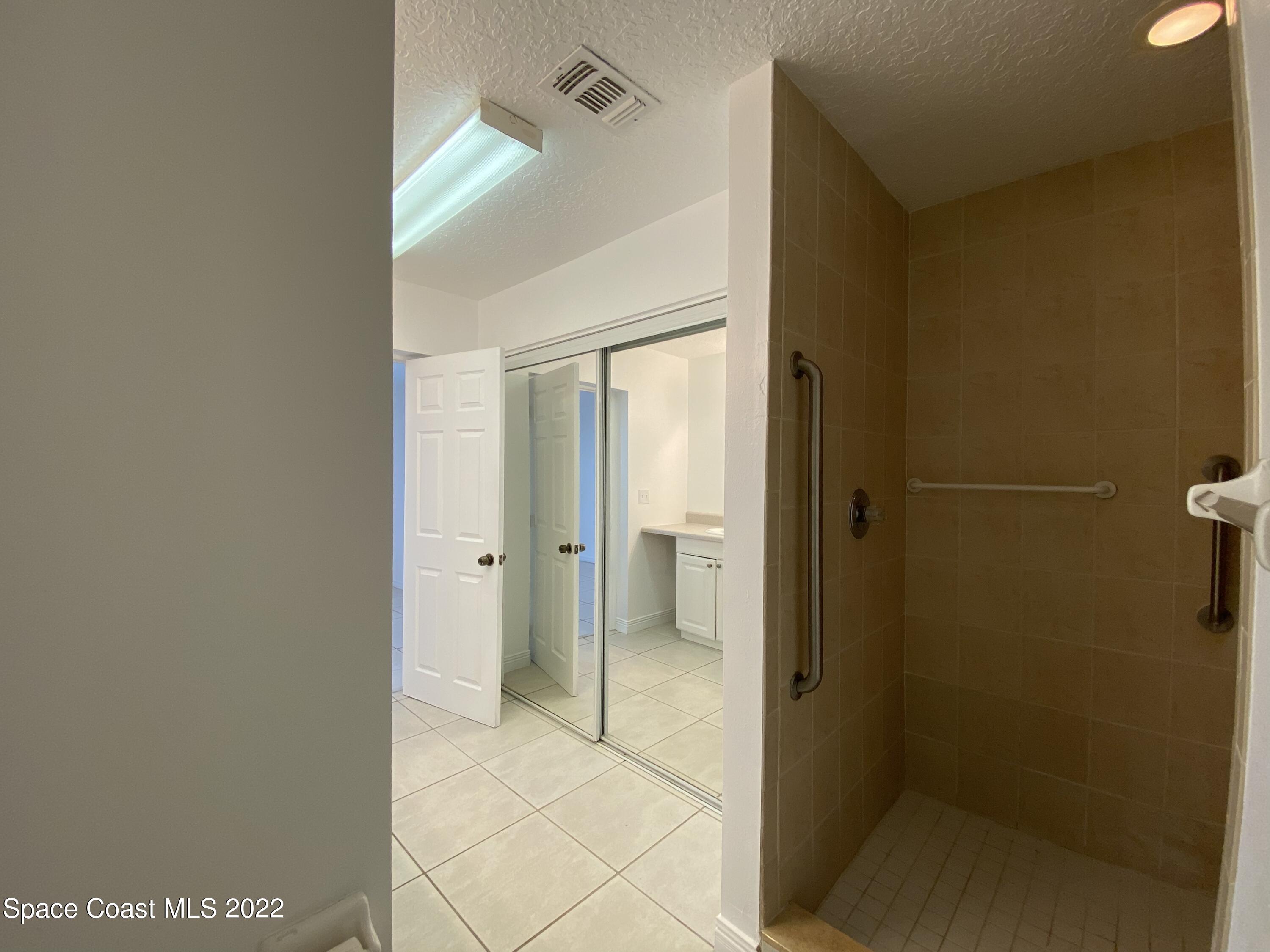 4120 Duke Street Melbourne, FL 32901 - Photo 29 of 49 a bathroom with a shower and a glass door