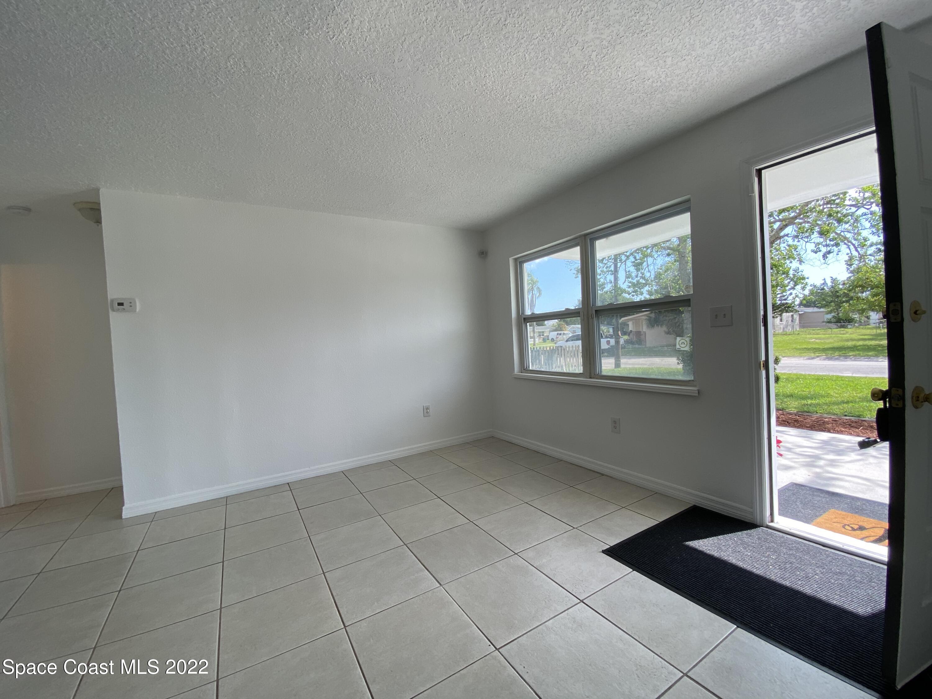 4120 Duke Street Melbourne, FL 32901 - Photo 40 of 49 a view of an empty room with a window