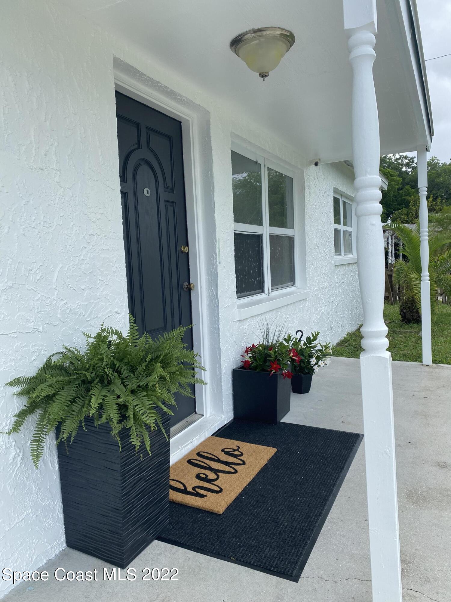 4120 Duke Street Melbourne, FL 32901 - Photo 4 of 49 a view of a two chairs and a table in the porch