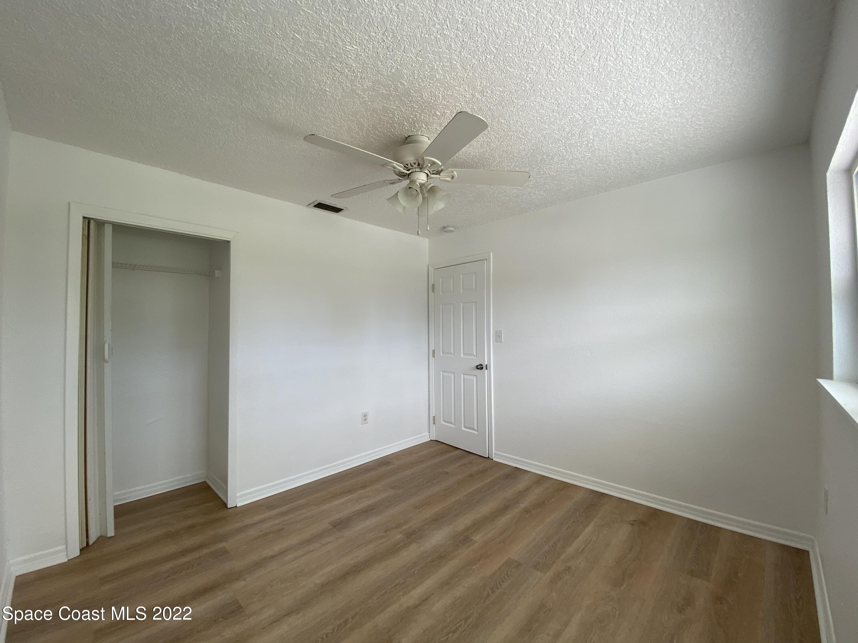4120 Duke Street Melbourne, FL 32901 - Photo 7 of 49 wooden floor in an empty room