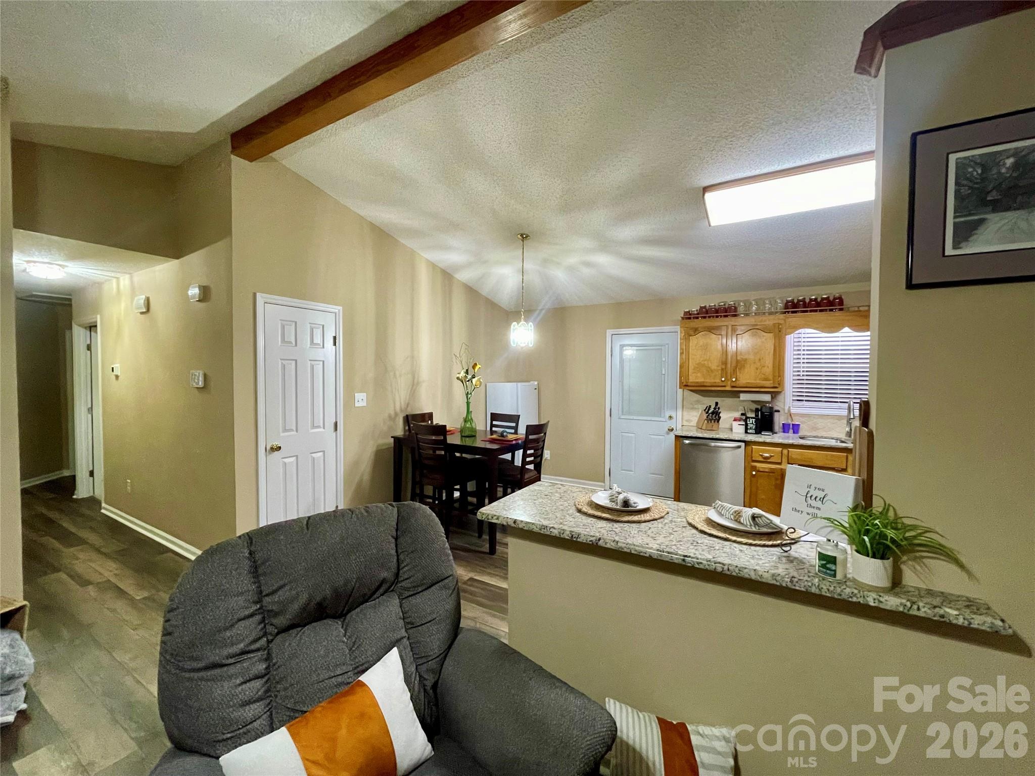 1676 Plyler Lake Road Gastonia, NC 28054 - Photo 17 of 33 a living room with furniture and a flat screen tv