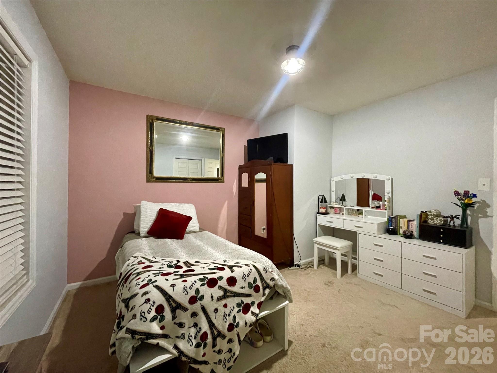 1676 Plyler Lake Road Gastonia, NC 28054 - Photo 24 of 33 a bedroom with a bed and a desk