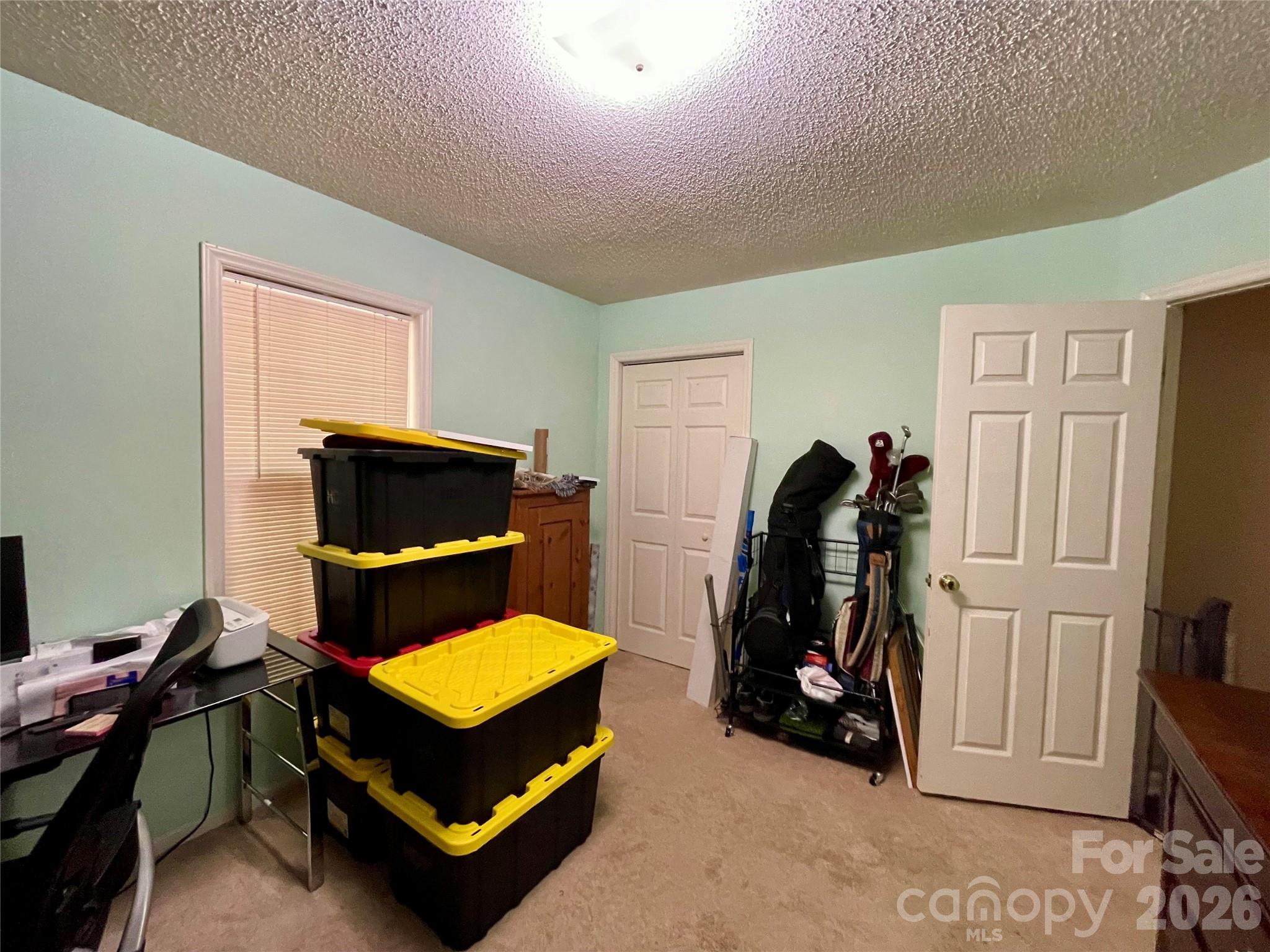 1676 Plyler Lake Road Gastonia, NC 28054 - Photo 26 of 33 a living room with furniture and a flat screen tv