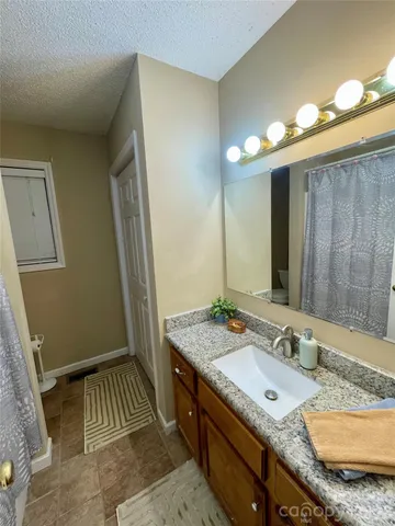 a balcony with wooden floor and fence