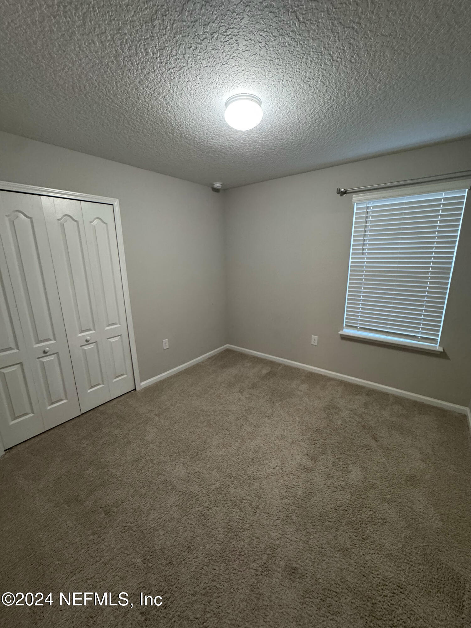 80 Balmoral Castle Drive St. Johns, FL 32259 - Photo 11 of 17 an empty room with windows