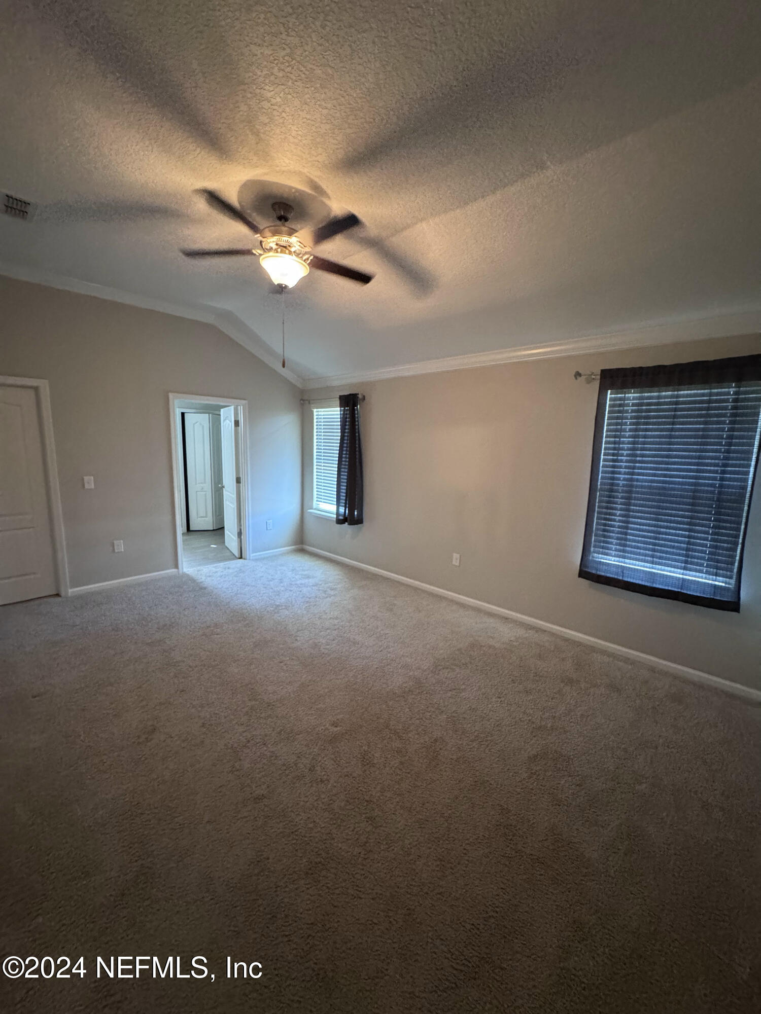 80 Balmoral Castle Drive St. Johns, FL 32259 - Photo 13 of 17 a view of a livingroom with a ceiling fan and window