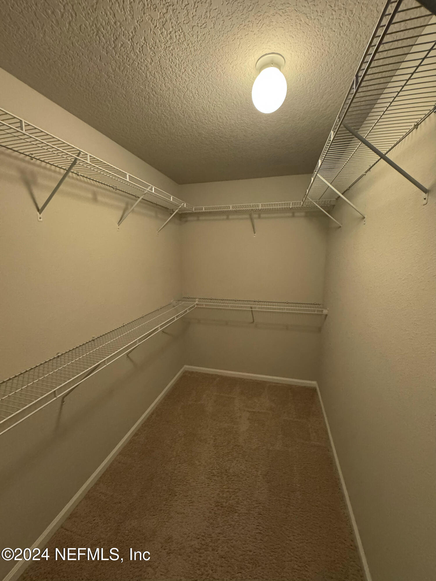 80 Balmoral Castle Drive St. Johns, FL 32259 - Photo 14 of 17 a view of a room with racks on the wall