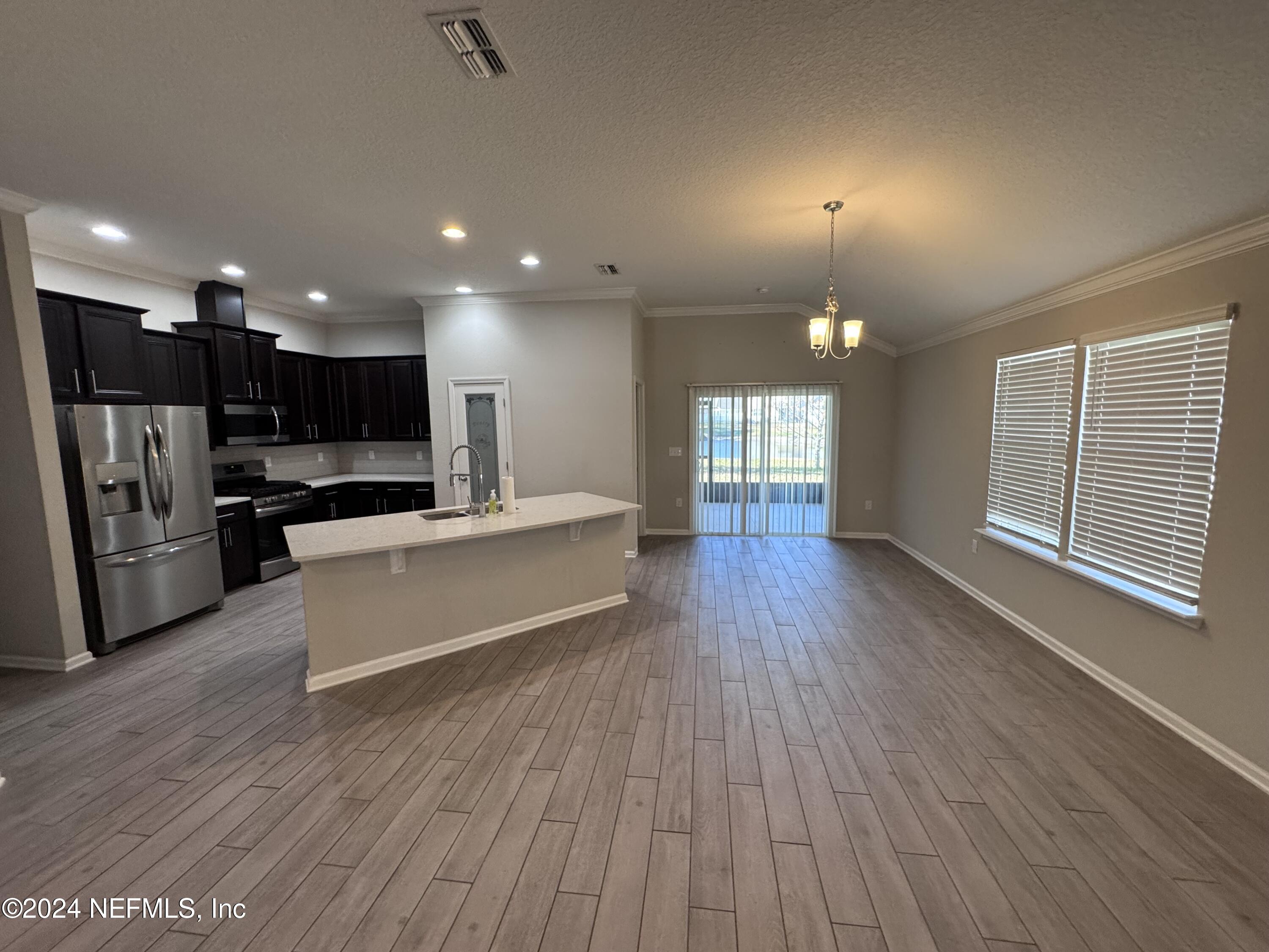 80 Balmoral Castle Drive St. Johns, FL 32259 - Photo 4 of 17 a view of kitchen with cabinets and wooden floor