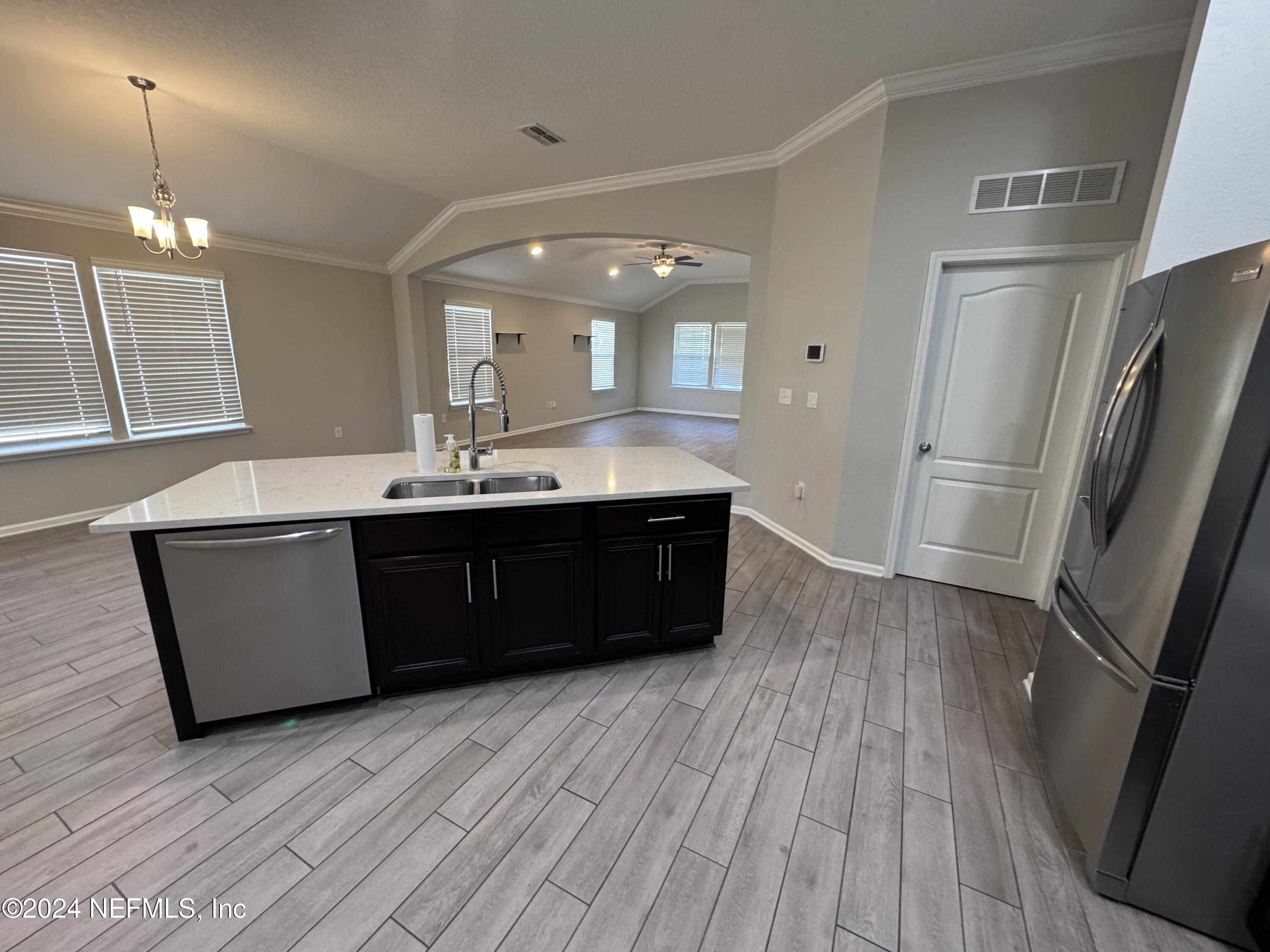 80 Balmoral Castle Drive St. Johns, FL 32259 - Photo 7 of 17 a bathroom with a sink a large mirror and vanity