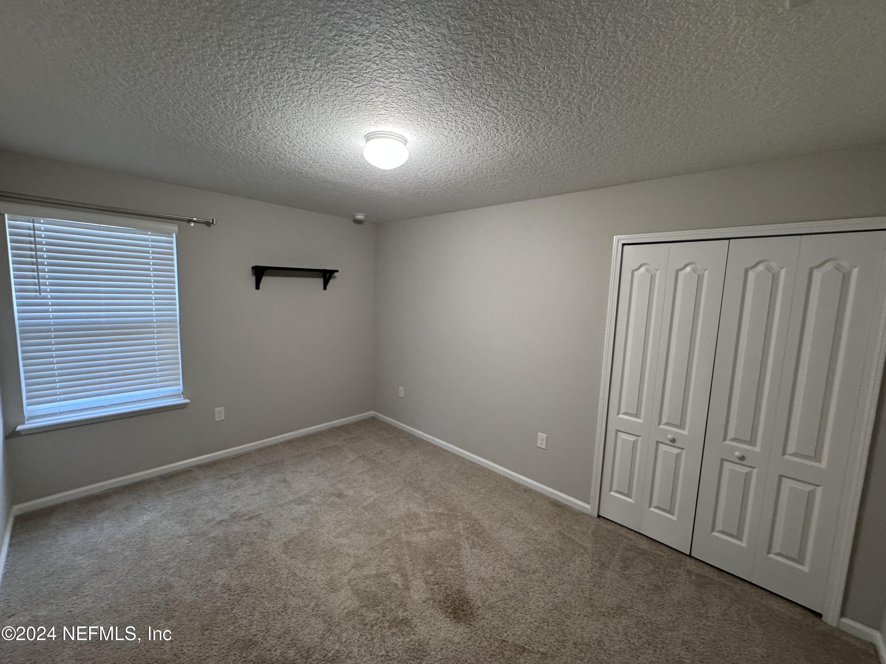 80 Balmoral Castle Drive St. Johns, FL 32259 - Photo 9 of 17 a view of an empty room with a window