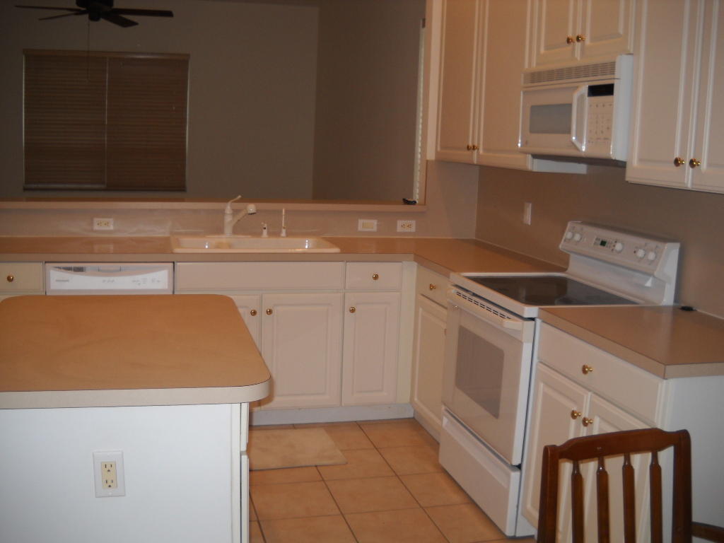 12831 Maypan Drive Boca Raton, FL 33428 - Photo 16 of 30 kitchen facing family room