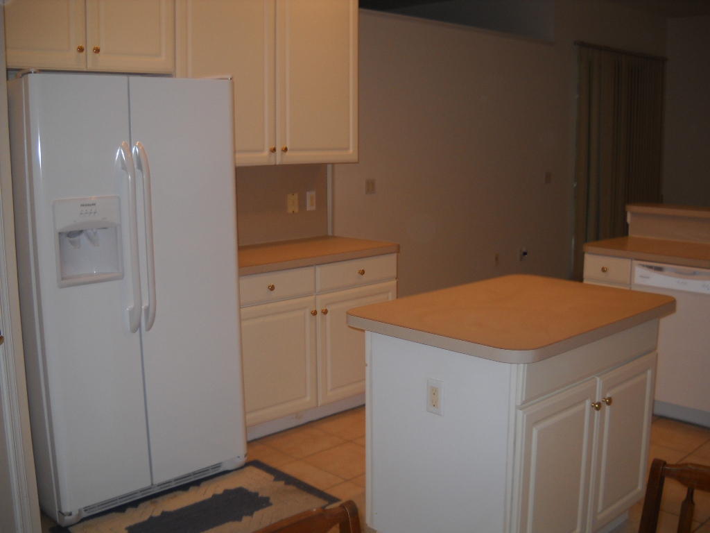 12831 Maypan Drive Boca Raton, FL 33428 - Photo 17 of 30 kitchen with island and refrigerator