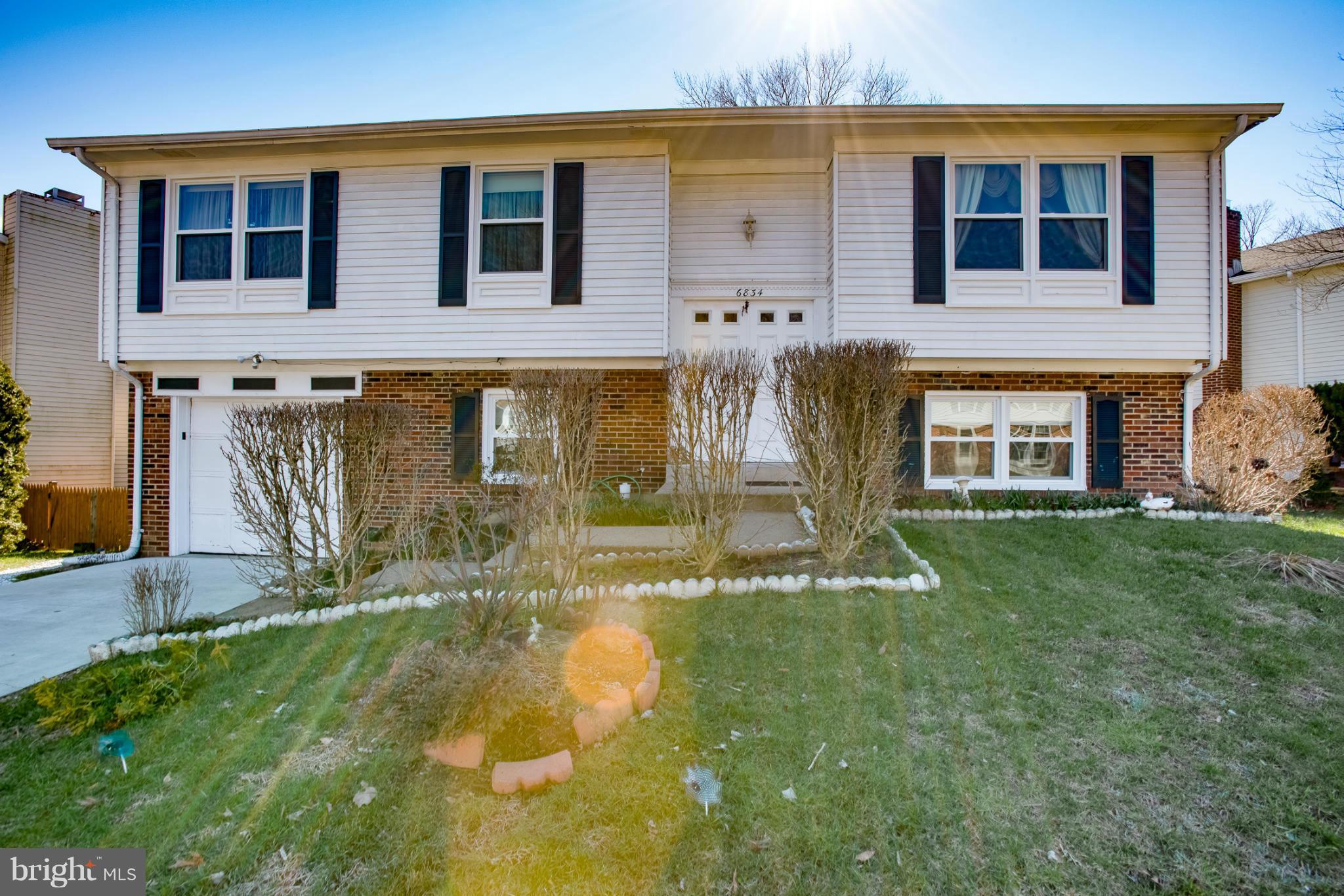 6834 Ben Franklin Road Springfield, VA 22150 - Photo 22 of 30 a front view of a house with a yard
