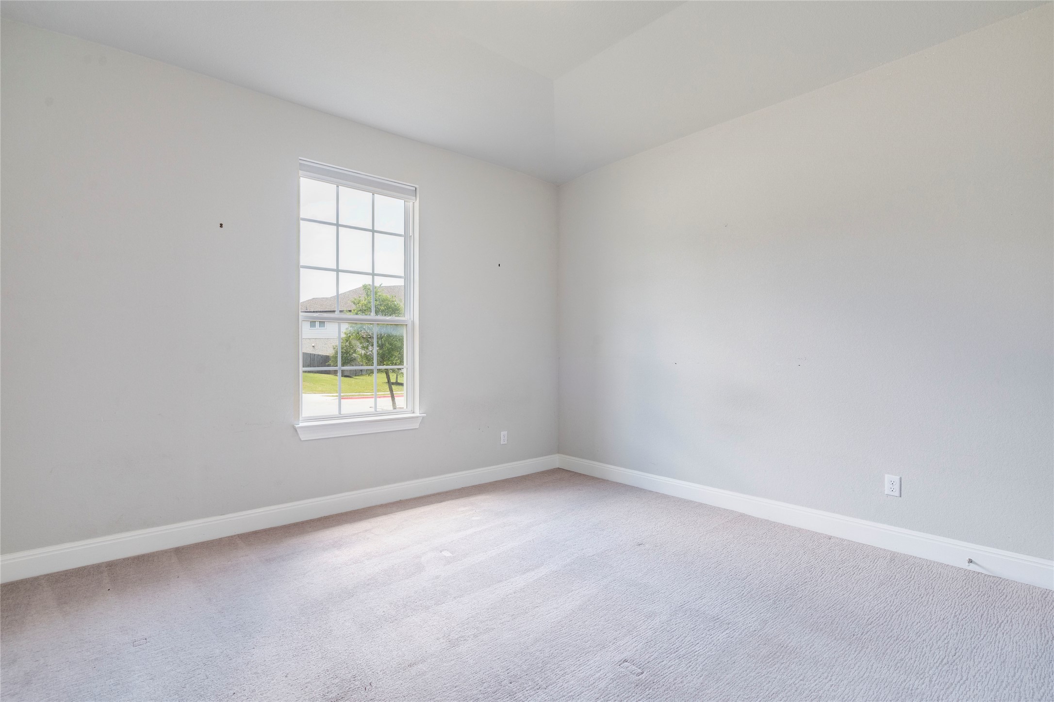 130 Sierra Blanca Road Dripping Springs, TX 78620 - Photo 18 of 24 an empty room with a window