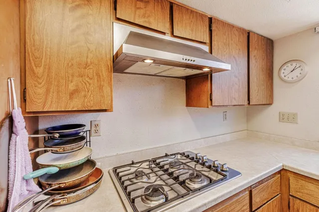 a kitchen with a stove and a microwave