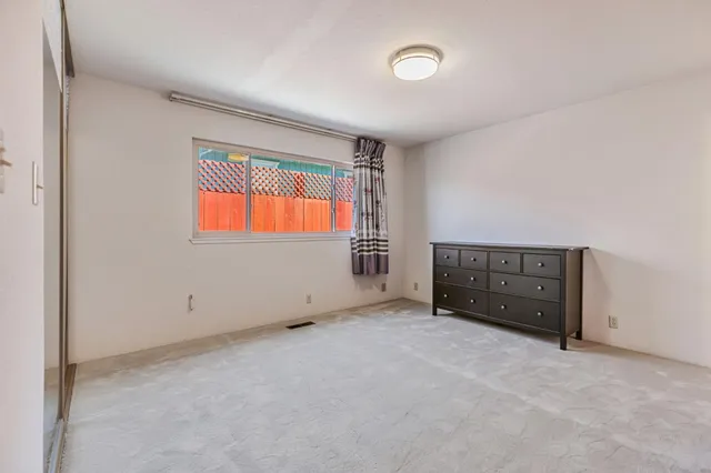 a room with a dresser in it