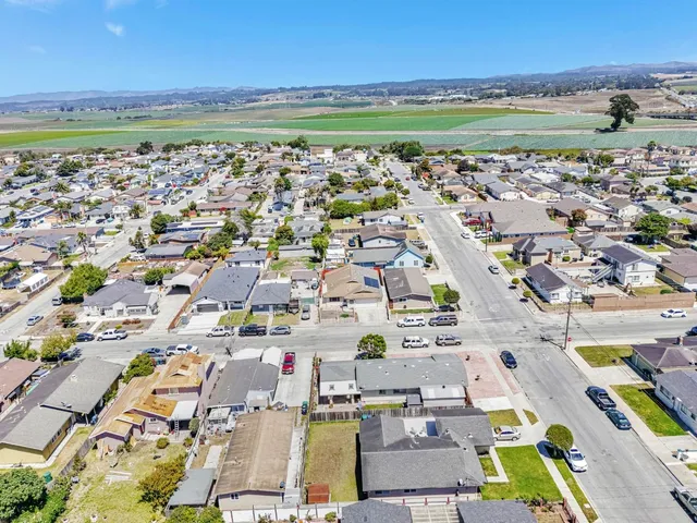 an aerial view of a building with beach