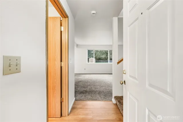 a view of a hallway with a dining room