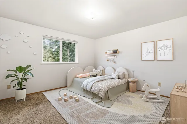 a bedroom with two beds and a couch