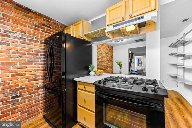 a kitchen with a stove and a cabinets
