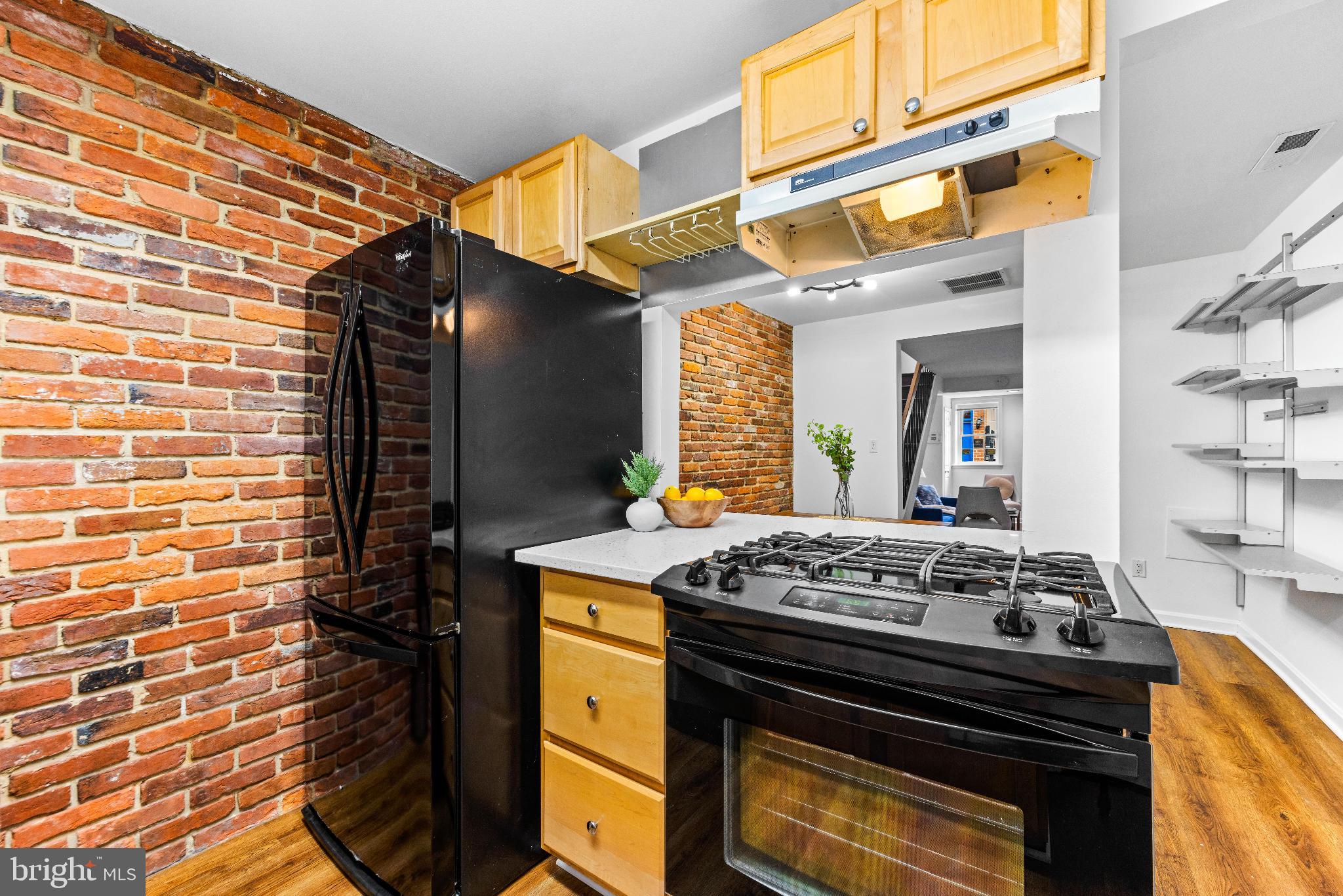 1046 Patapsco Street Baltimore, MD 21230 - Photo 9 of 19 a kitchen with a stove and a cabinets