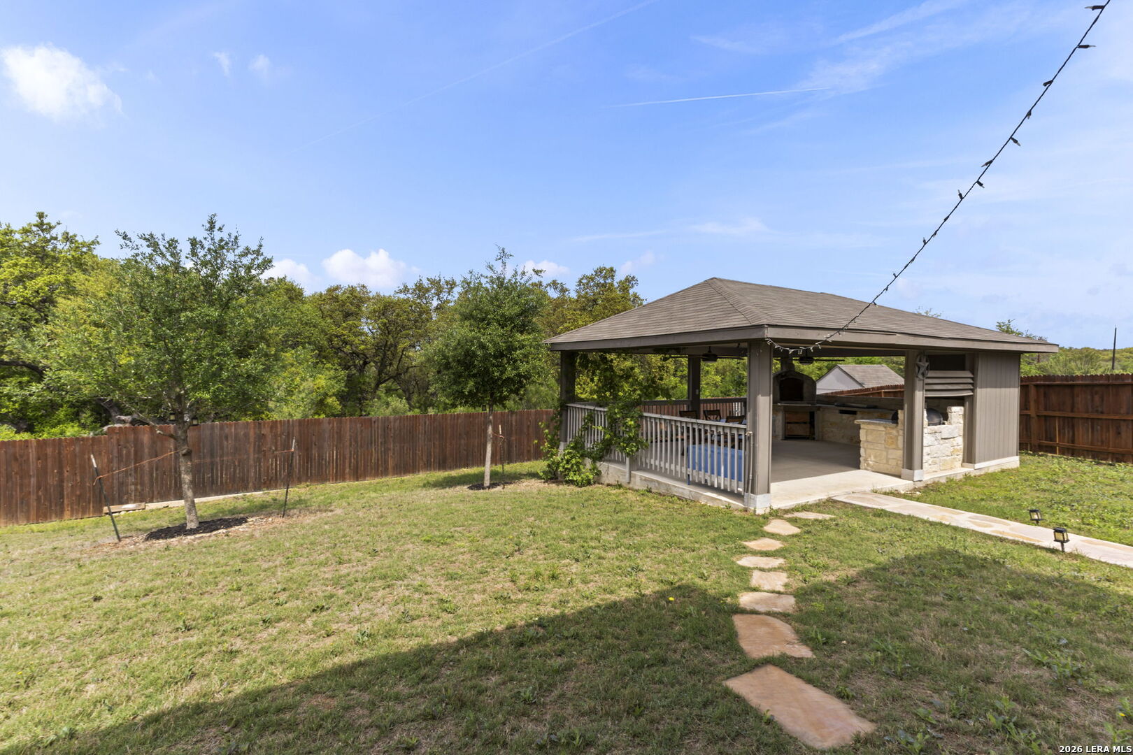 12221 Icon Ridge San Antonio, TX 78253 - Photo 40 of 46 a view of a house with a yard and sitting area