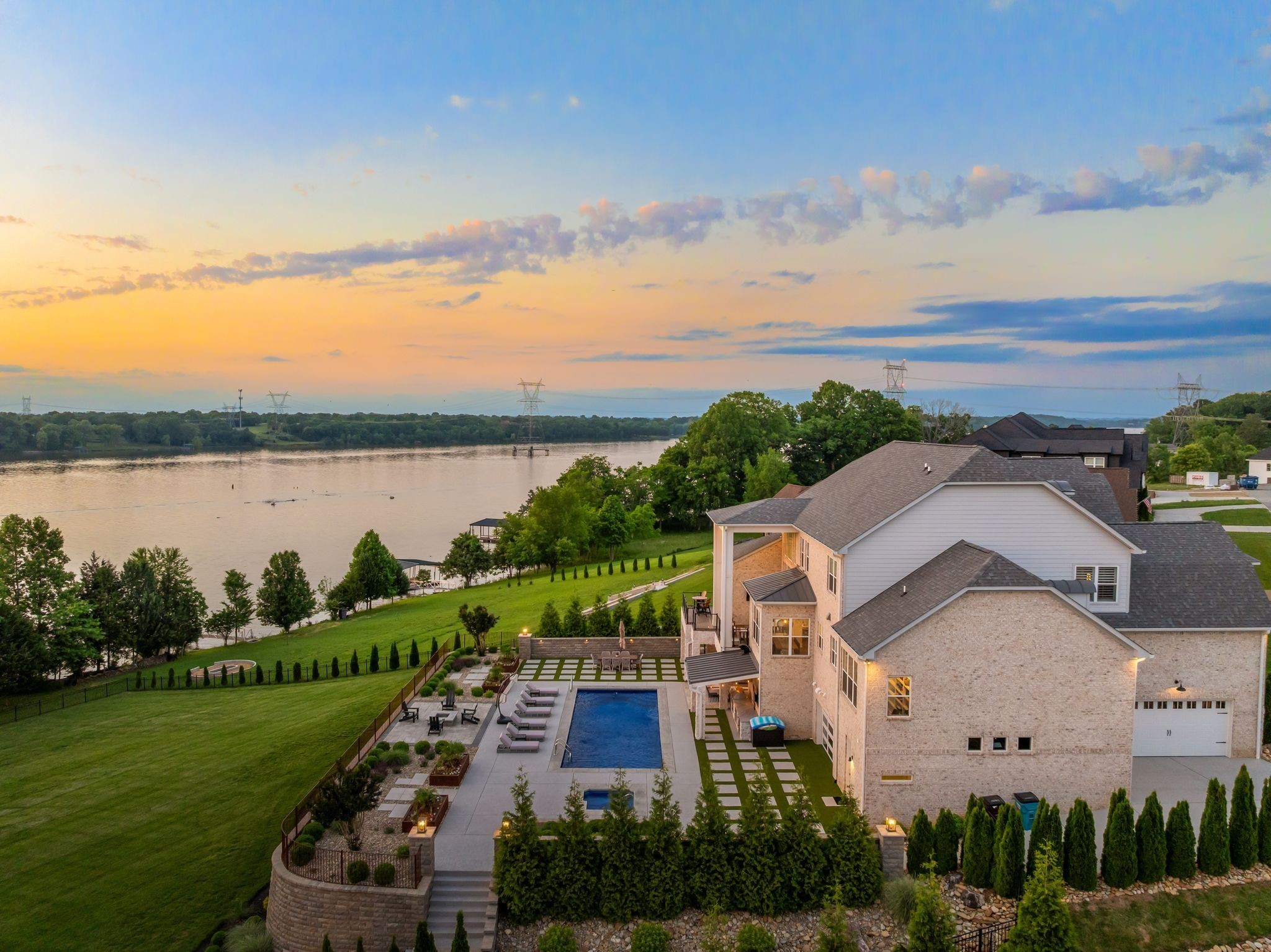 141 Kathryn Adele Lane Mount Juliet, TN 37122 - Photo 3 of 74 an aerial view of a house with green landscape and water view