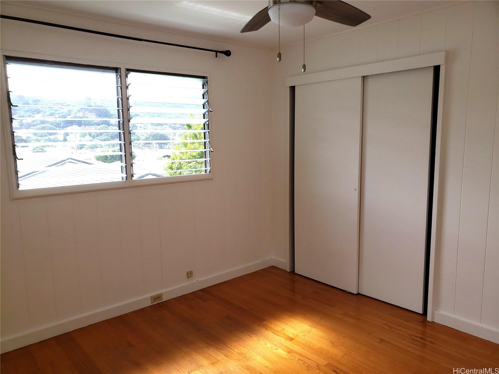 2313 Star Road, Unit A Honolulu, HI 96813 - Photo 14 of 21 a view of an empty room with wooden floor and a window