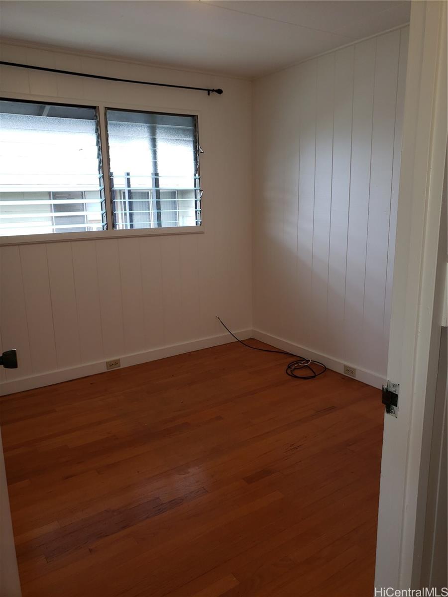 2313 Star Road, Unit A Honolulu, HI 96813 - Photo 16 of 21 an empty room with wooden floor and windows
