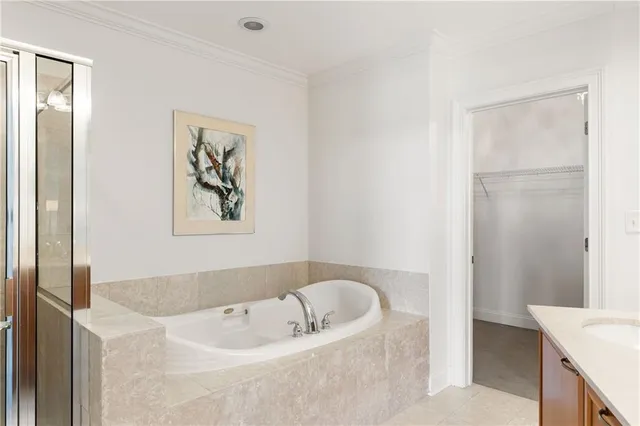 a bathroom with a bathtub and a sink