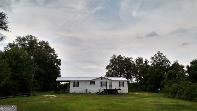 2625 Ben Carter Road Baxley, GA 31513 - Photo 1 of 1 a view of a house with garden
